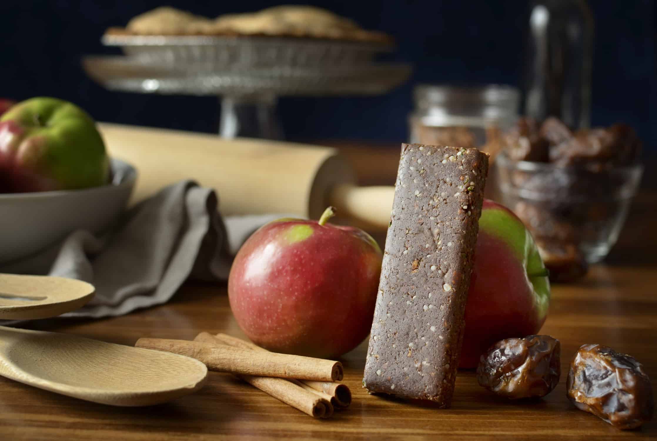 Fit Cricket Protein Bar leaning on an apple 