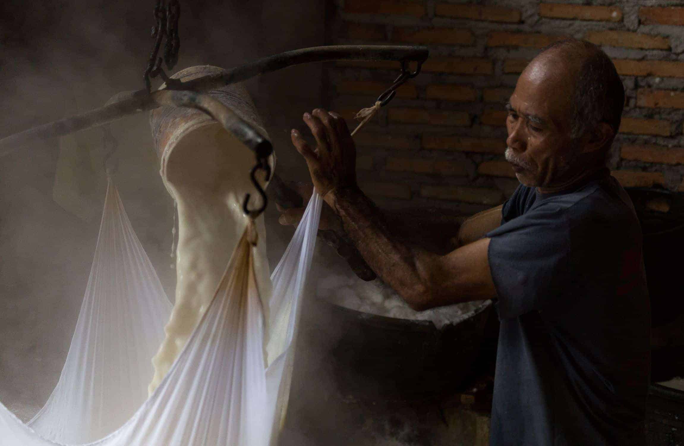 Man pouring liquid into a separator 